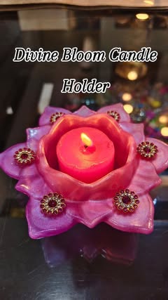 Pink lotus resin candle holder with lit candle