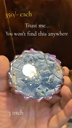 Oceania resin coaster held in hand